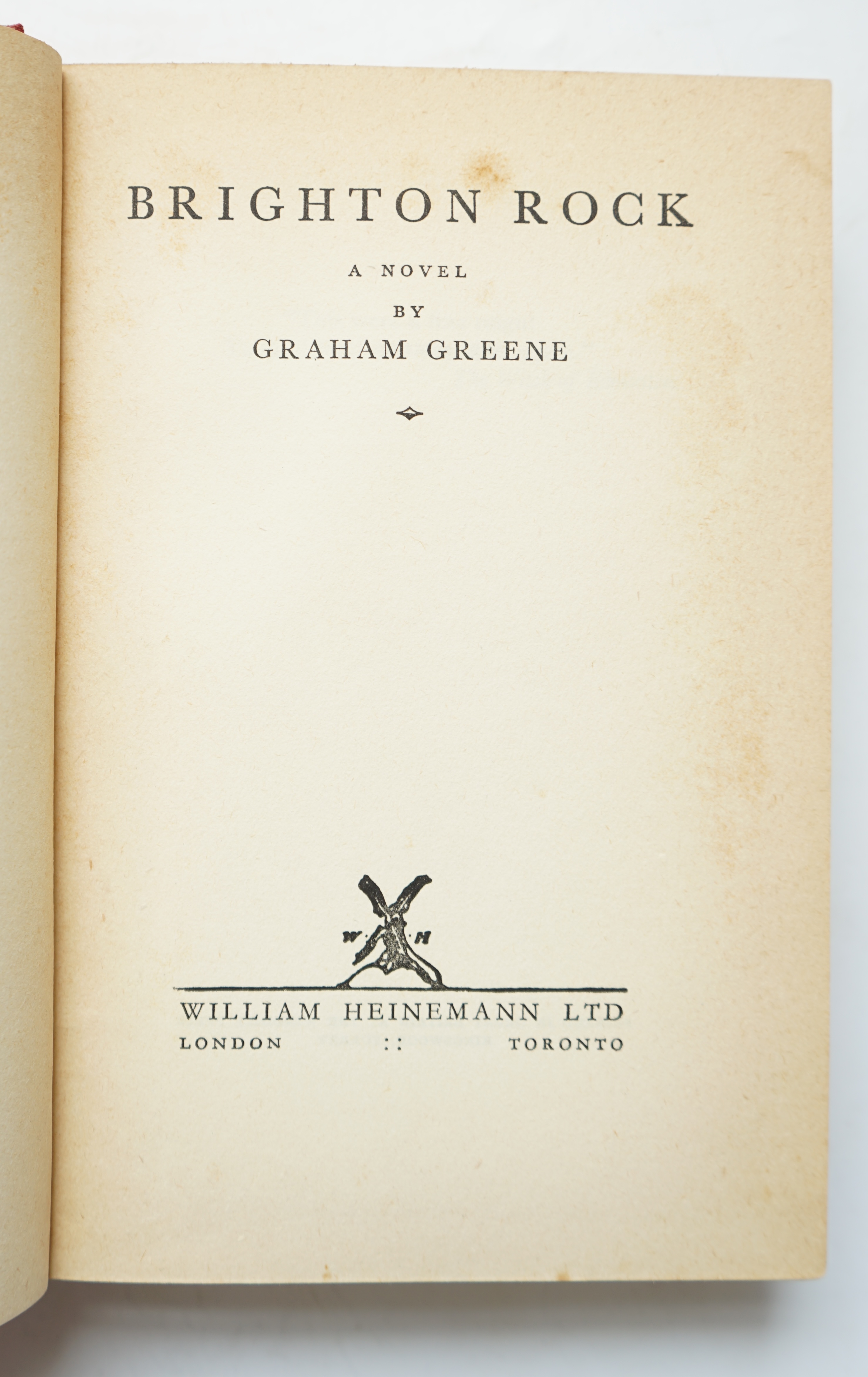 Greene, Graham - Brighton Rock, 1st English edition, 8vo, original red cloth, with some toning to margins and endpapers, (as often), closed tear to margin of pp, 343 and 359, William Heinemann Ltd., London, 1938.